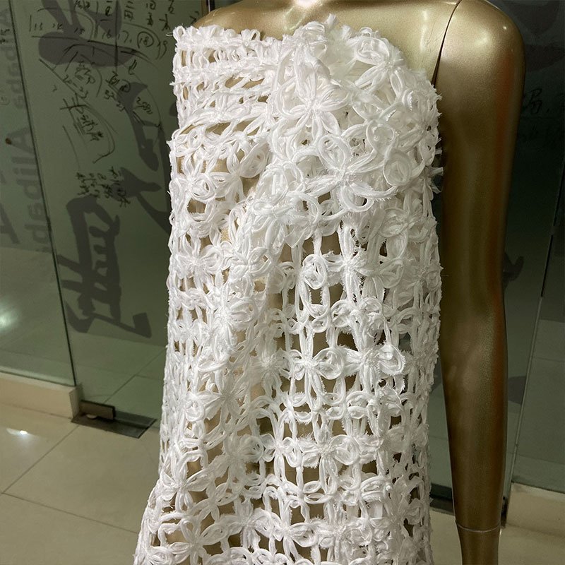New arrival 100% polyester 180gsm comfortable hollow out pure white floral pattern sequins embroidery fabric for wedding dress