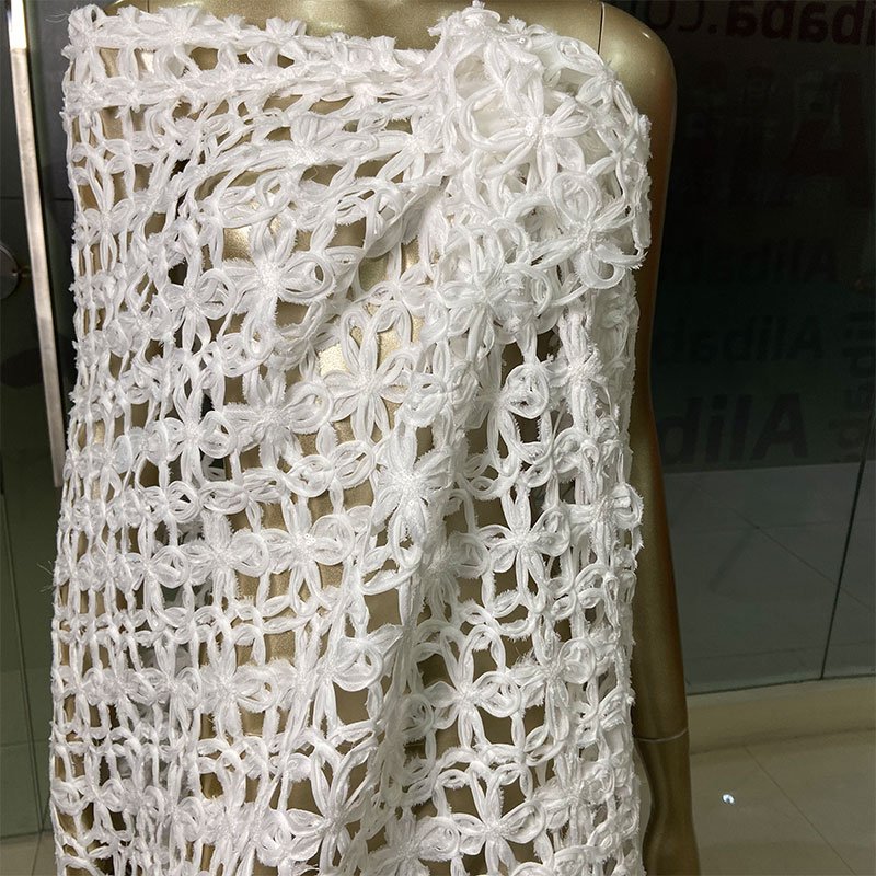 New arrival 100% polyester 180gsm comfortable hollow out pure white floral pattern sequins embroidery fabric for wedding dress