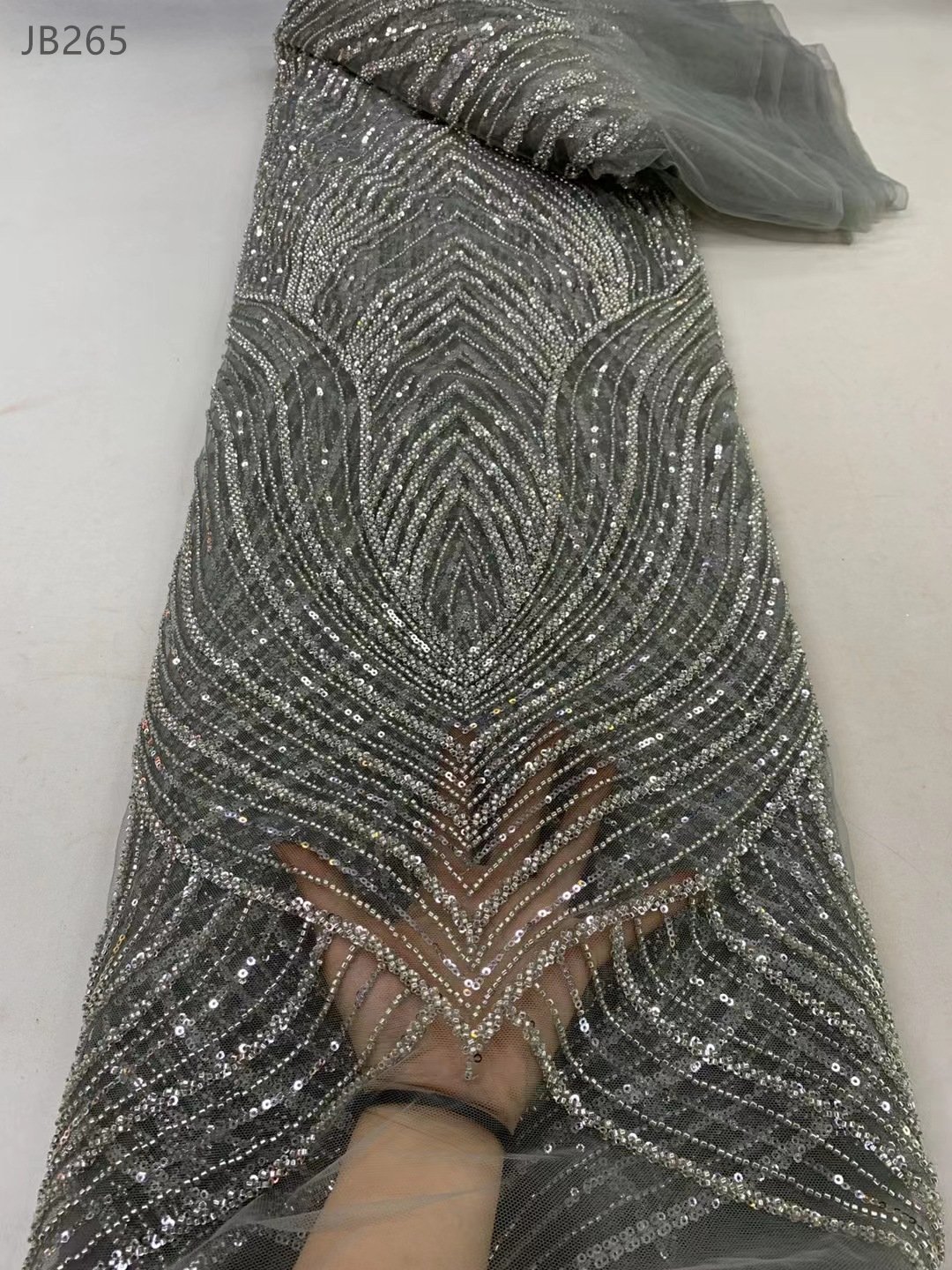 New design bridal heavy lace embroidery fabrics wedding dress low price crystal beaded lace fabric for party dress