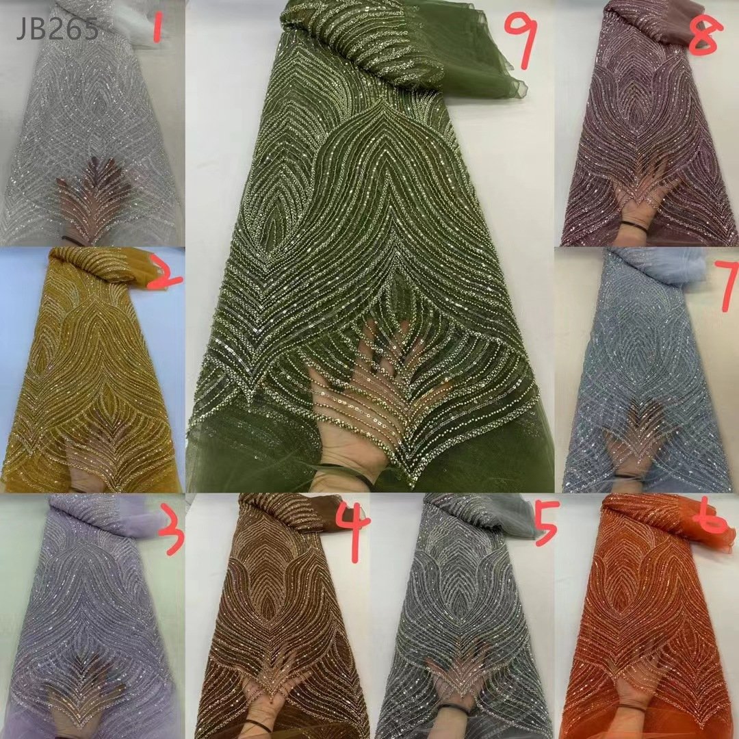 New design bridal heavy lace embroidery fabrics wedding dress low price crystal beaded lace fabric for party dress