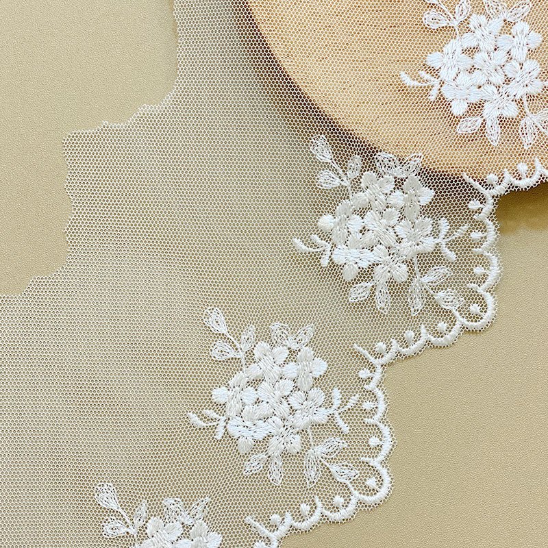 wholesale Manufacturers supply polyester silk plum embroidery mesh lace spot