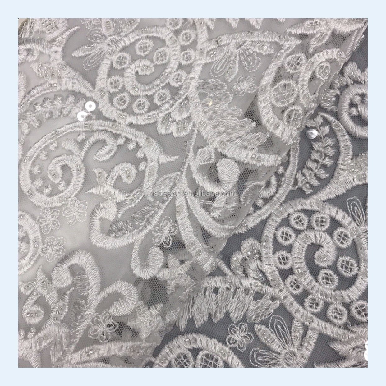 New wholesale white sequins beaded embroidery lace. Bridal gown sparkling sequins beaded lace fabric.