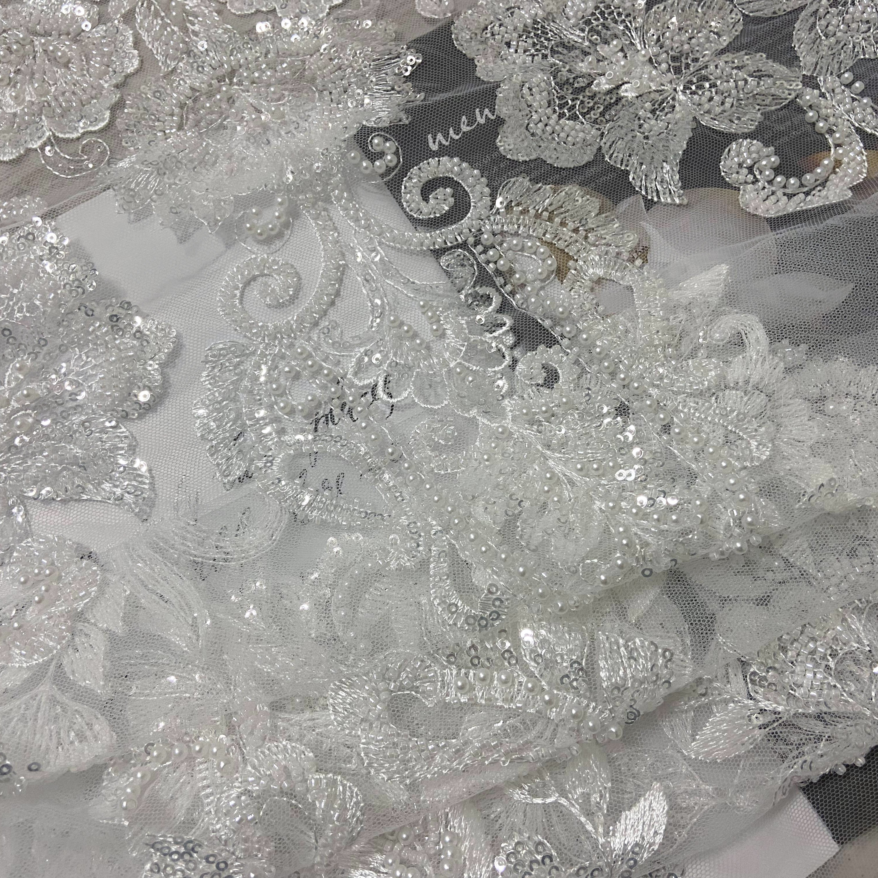 Hand cut african white beaded lace fabric