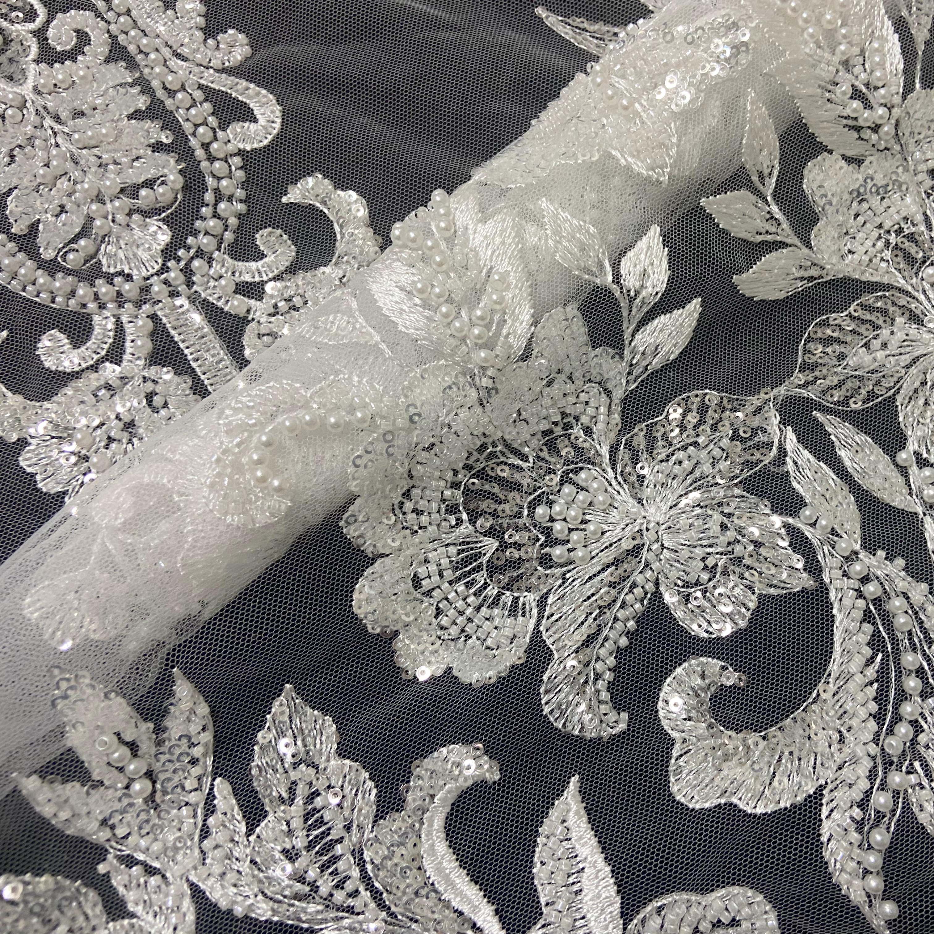 Hand cut african white beaded lace fabric