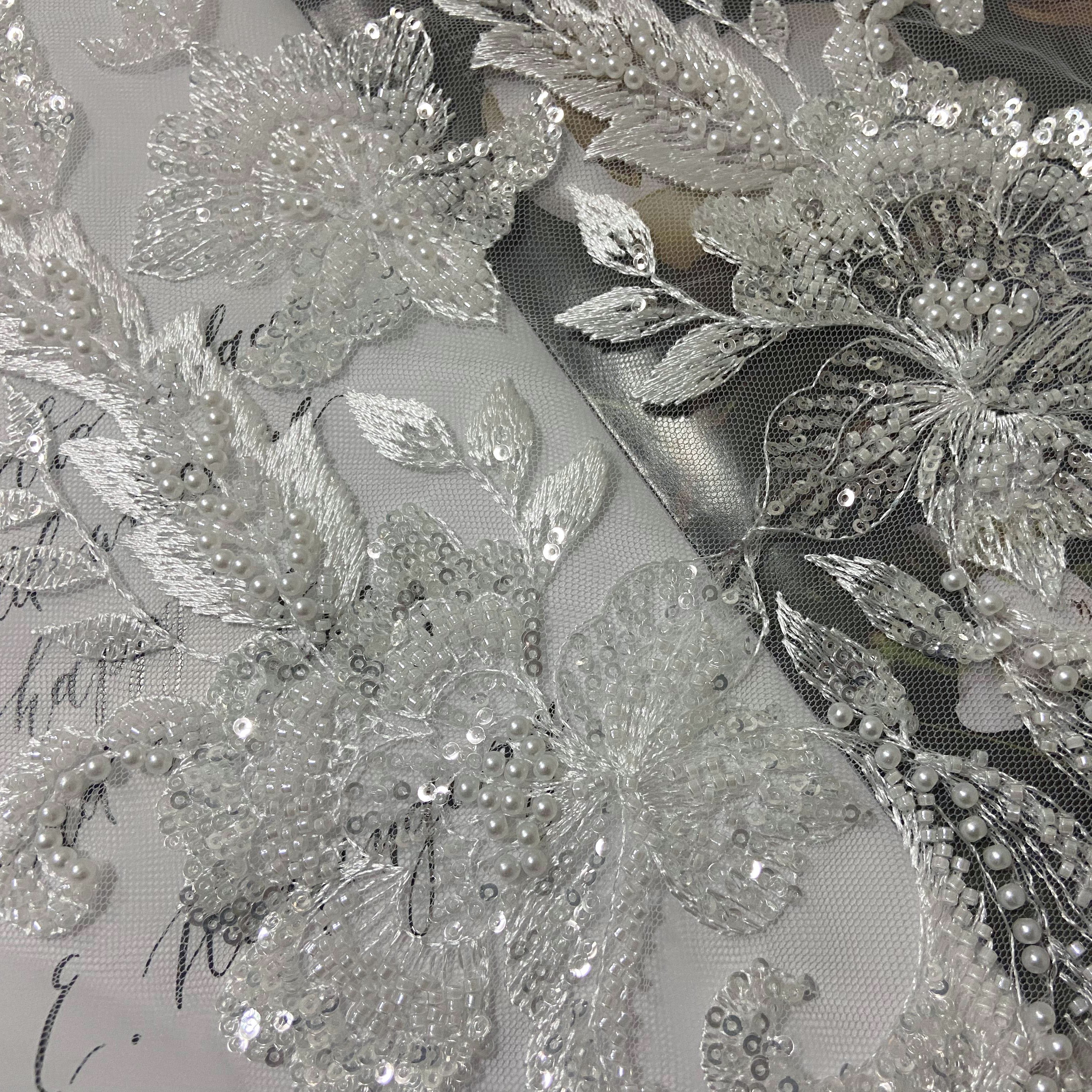 Hand cut african white beaded lace fabric