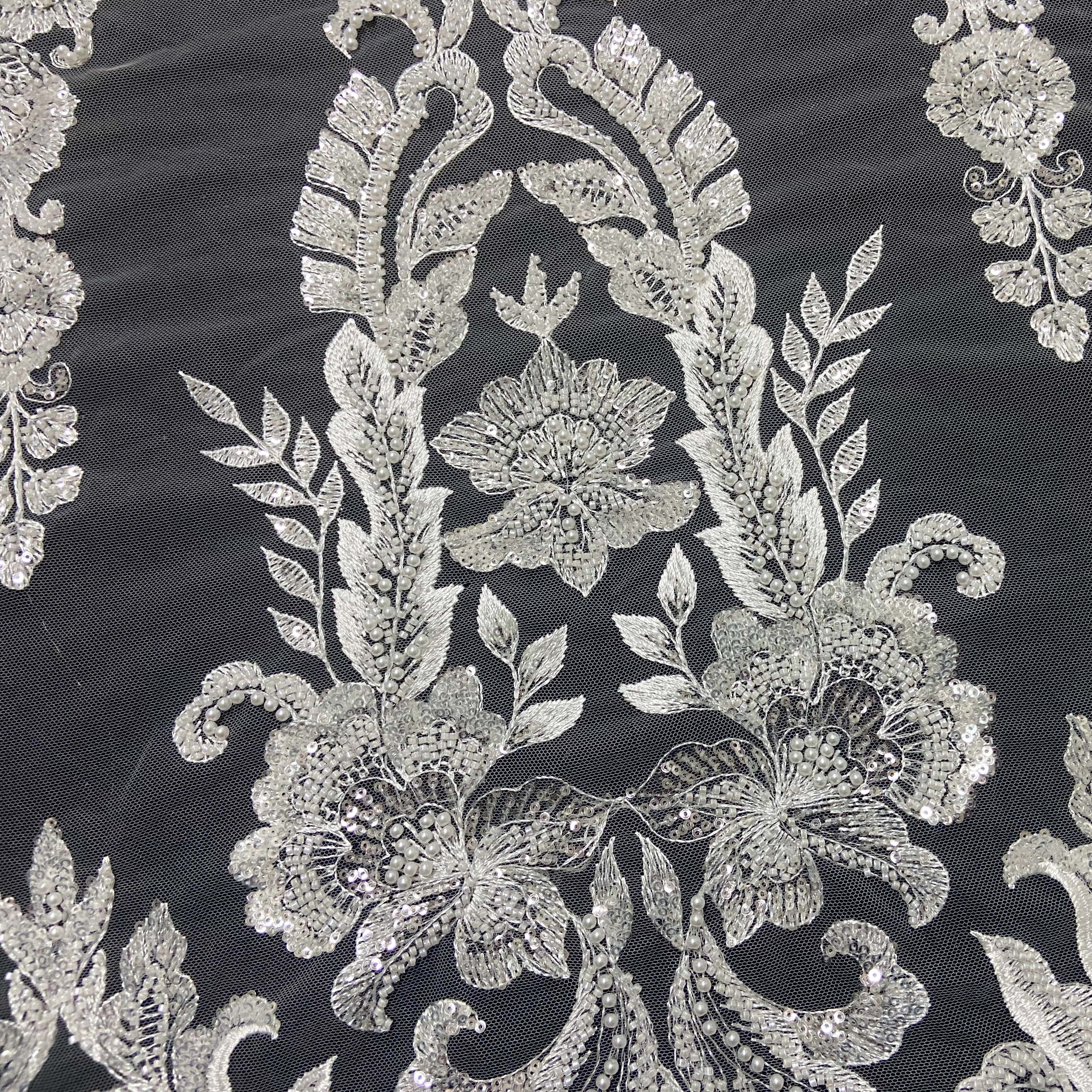 Hand cut african white beaded lace fabric