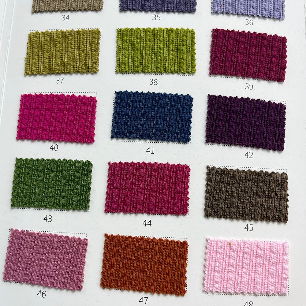 Wholesale ribbed 66.5% polyester 28.5% rayon 5% spandex 260g TR jacquard rib knitted fabric for Women tops