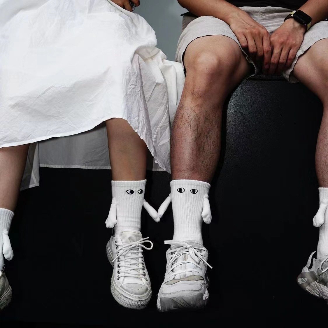 Funny black white solid color ribbed eye embroidery magnetic couple hold hands socks