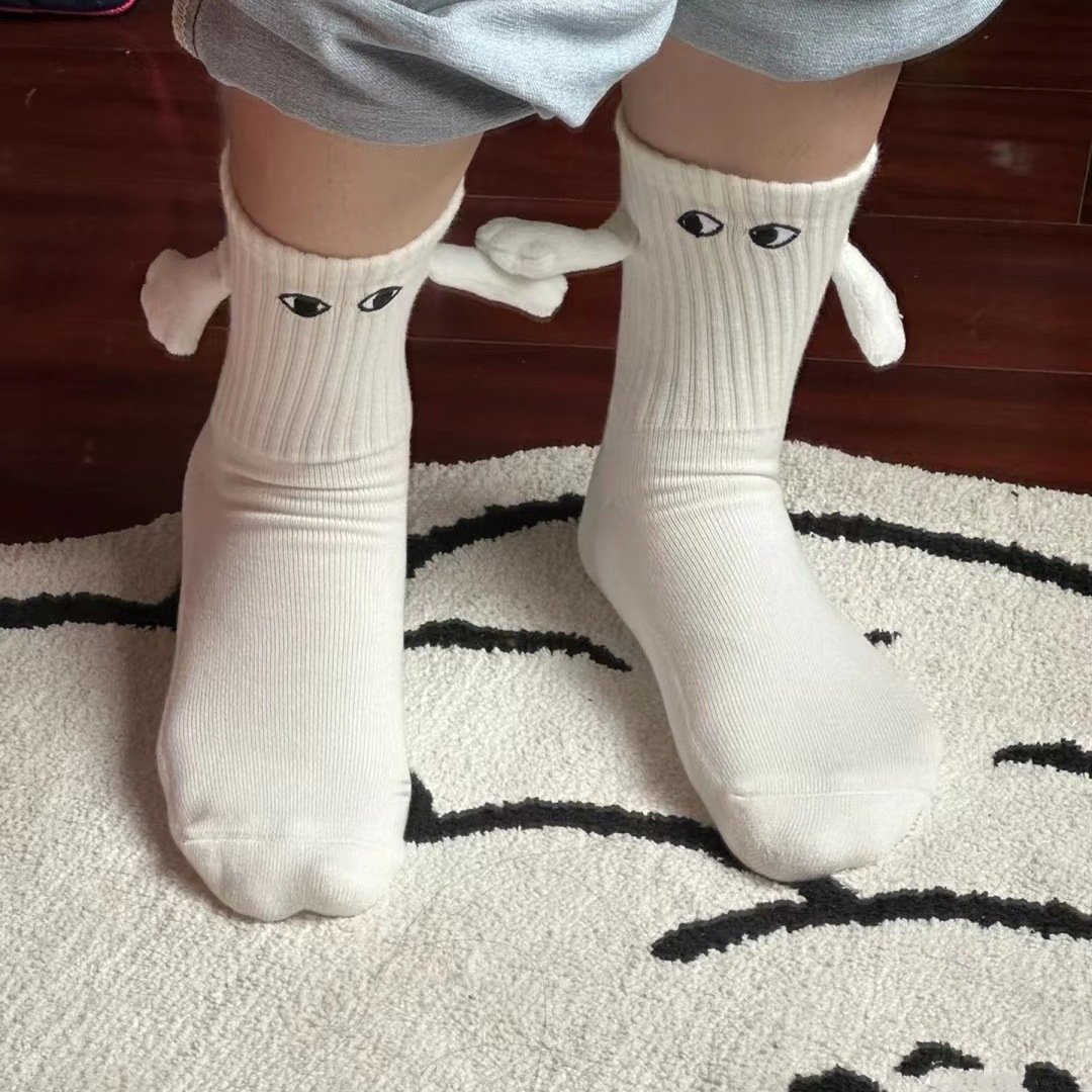 Funny black white solid color ribbed eye embroidery magnetic couple hold hands socks