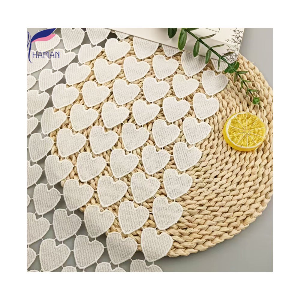 Exquisite hollow love pattern 100% polyester milk silk embroidery fabric for clothing and wallpaper