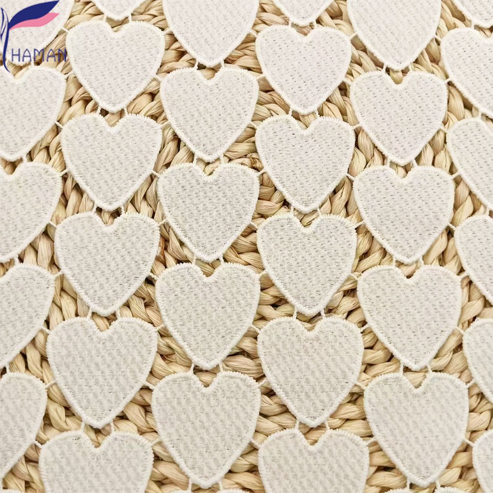 Exquisite hollow love pattern 100% polyester milk silk embroidery fabric for clothing and wallpaper