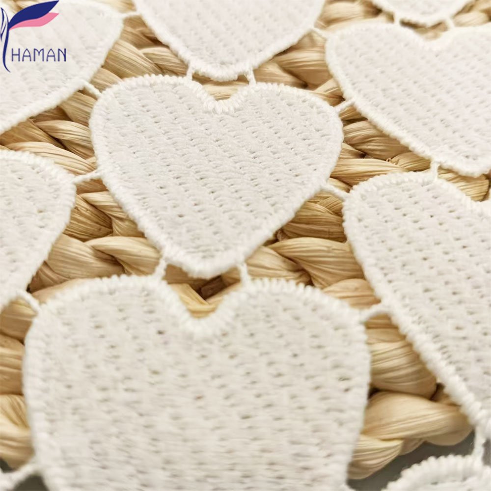 Exquisite hollow love pattern 100% polyester milk silk embroidery fabric for clothing and wallpaper