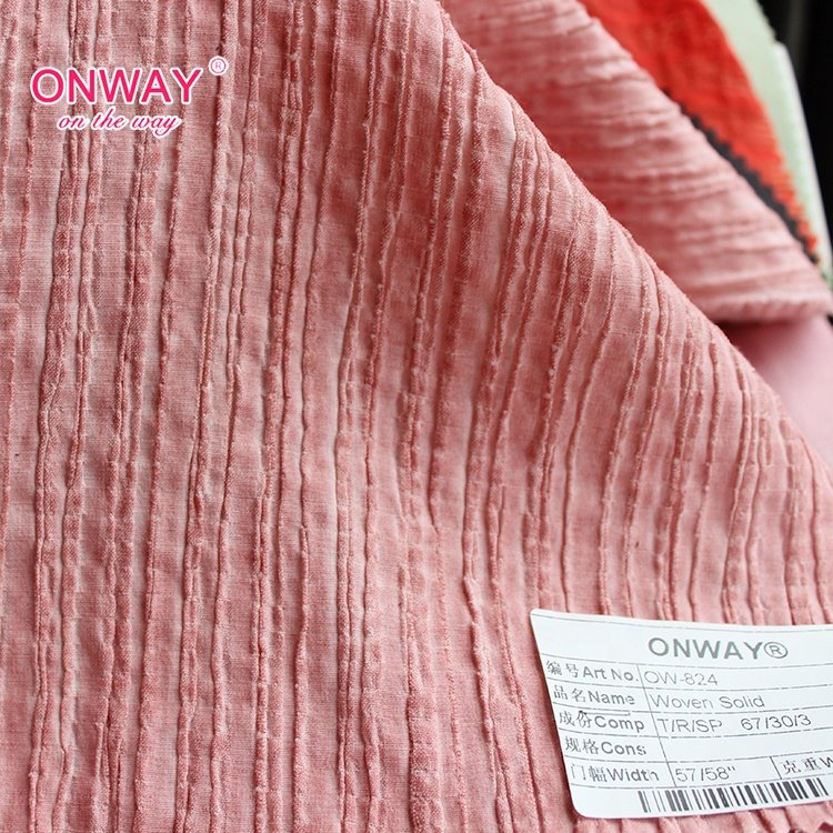 Garment textile good hand feeling classic design woven solid 67% tencel fabric wholesale