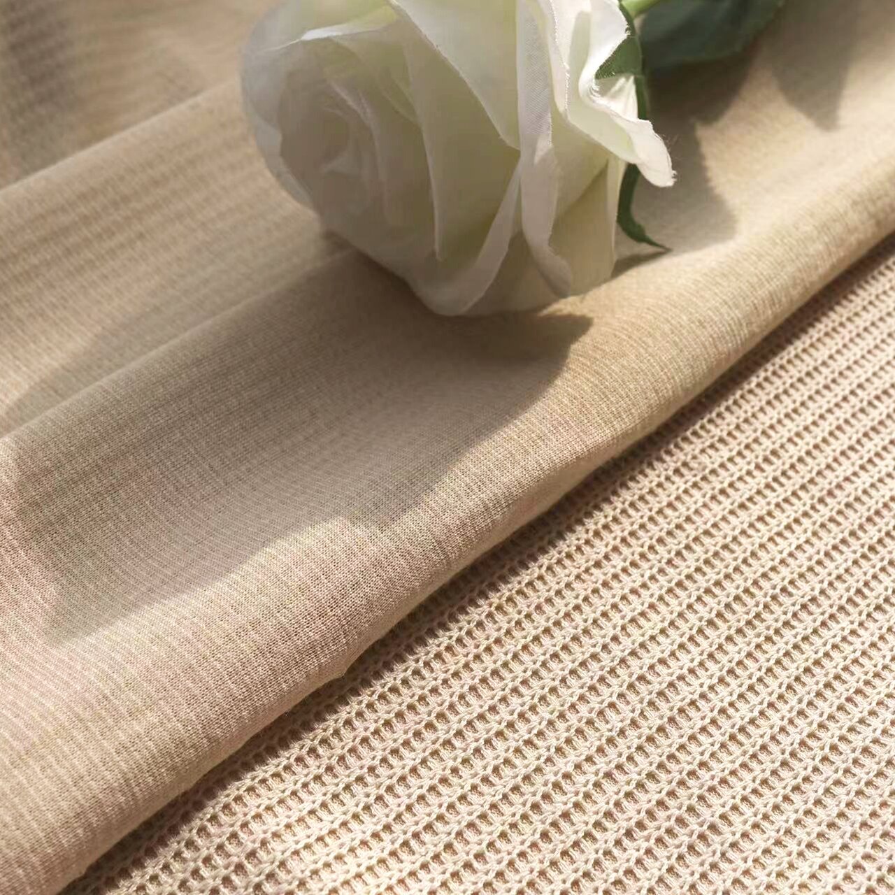 Multi-colored 15%R 85%T knitted twist sweater fabric is available from stock