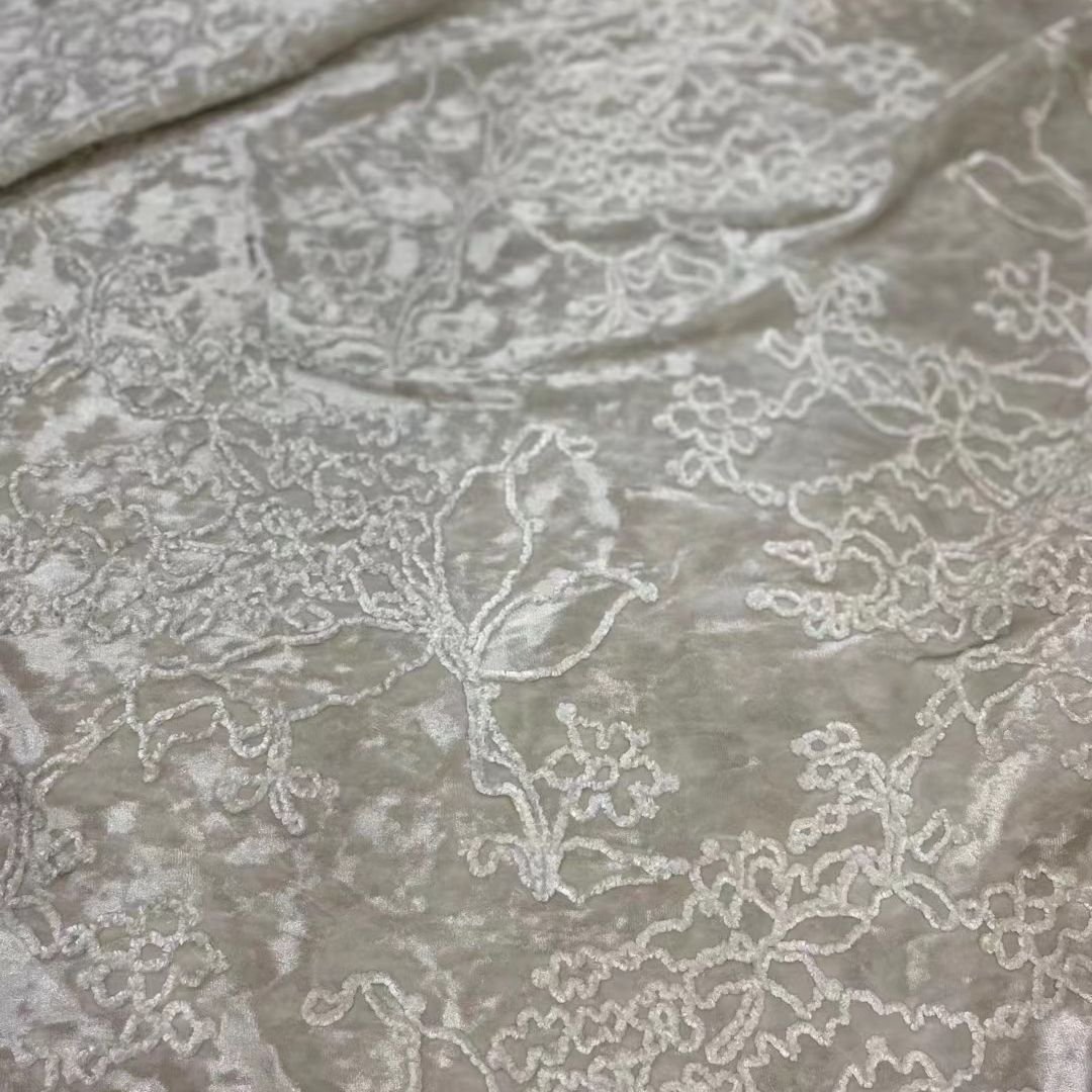 Nais luxury new pattern thick polyester white embroidered embossed 3d floral pattern velvet black fabrics for winter clothing