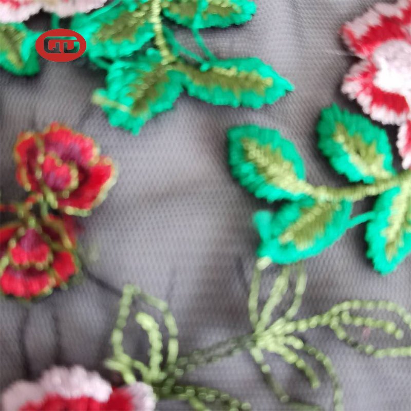 High fashion custom colorful flowers floral flat embroidery tulle mesh fabric for ladies dress