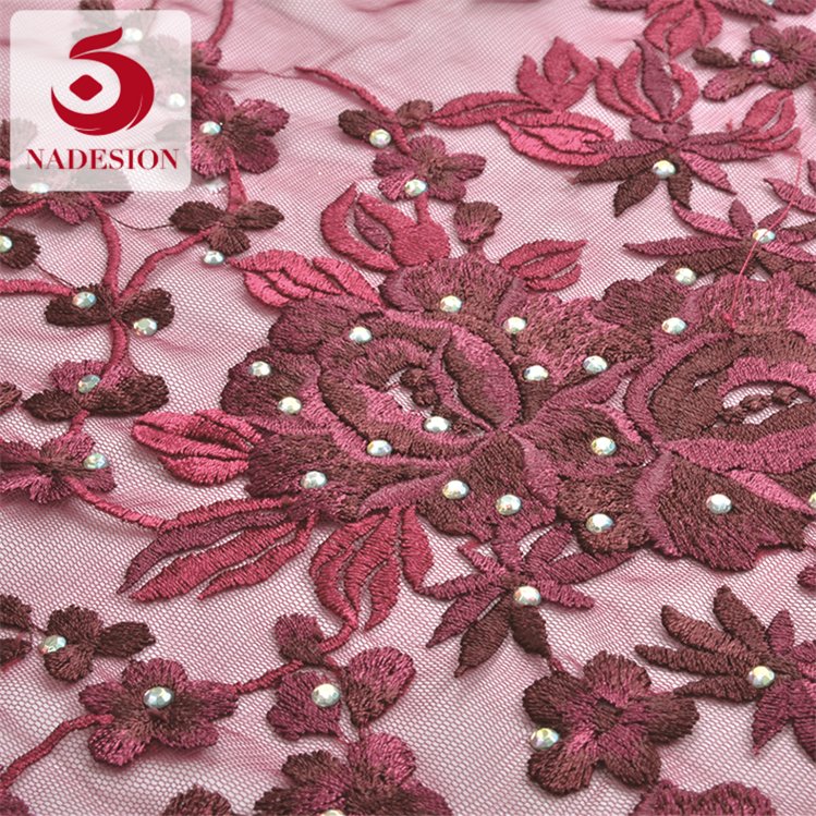 Hot selling fancy design stone embroidery design/schiffli embroidery fabrics