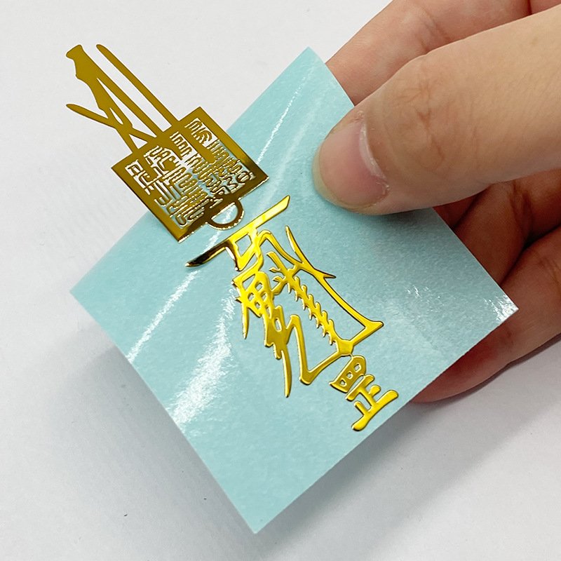 Custom Printing 3d Logo Clear Labels Dtf Bronze Foil Vinyl Label Uv Metal Transfer Sticker For Box Bottles Candles Packaging