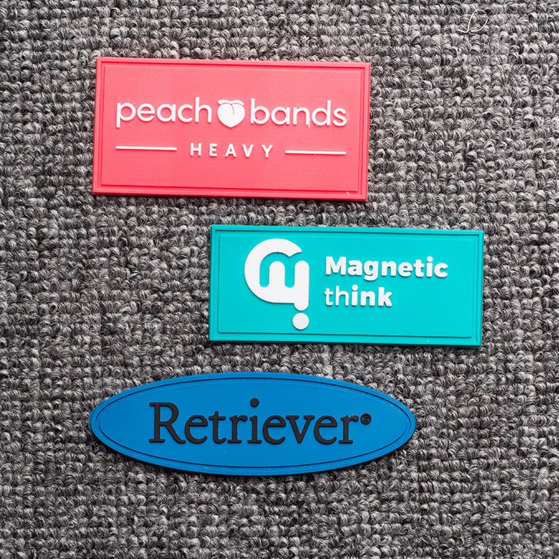 Promotional soft pvc tags heat transfer custom 3D embossed logo brand rubber silicon label for clothing