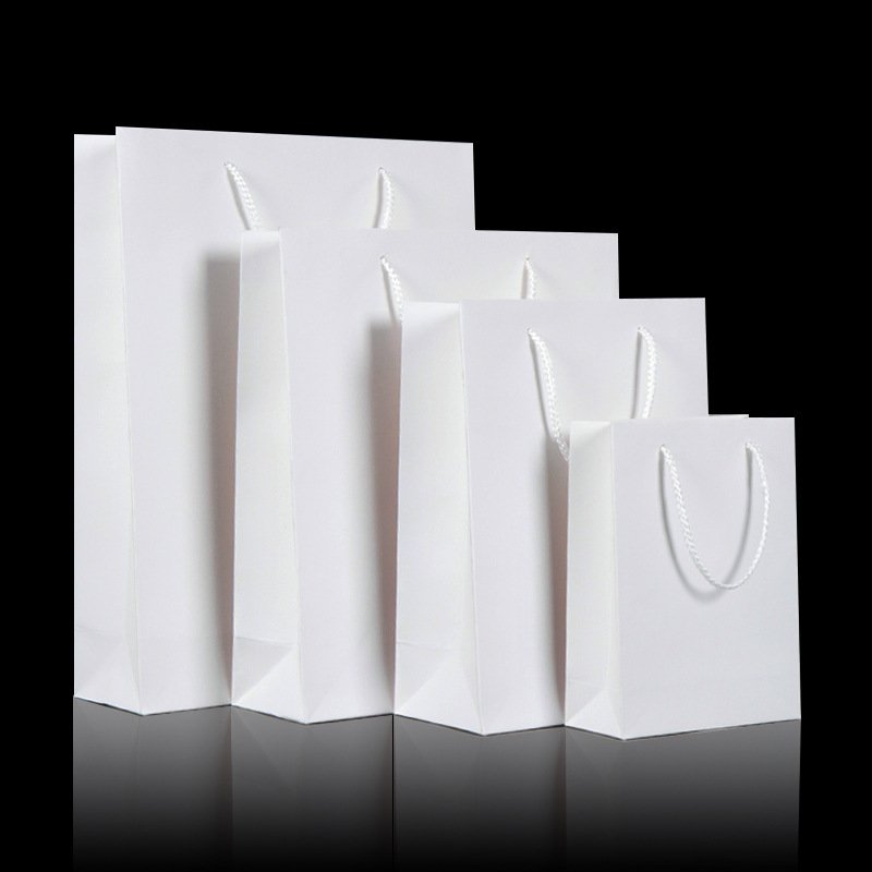 China Factory Wholesale PP Handle Clothing Package Bags Ivory Paper Shopping Bags With Your Own Logo Apparel Promotional Bags