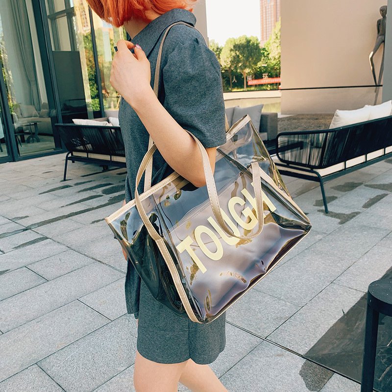 Custom Logo embossed holographic PVC tote bag for cosmetic packaging lifestyle shopping bag reusable waterproof shoulder bag