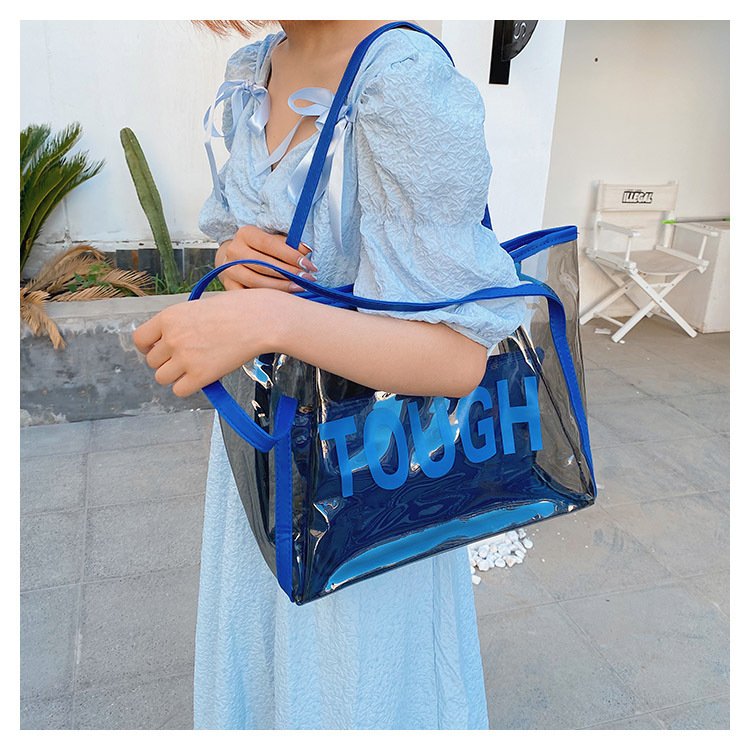 Custom Logo embossed holographic PVC tote bag for cosmetic packaging lifestyle shopping bag reusable waterproof shoulder bag