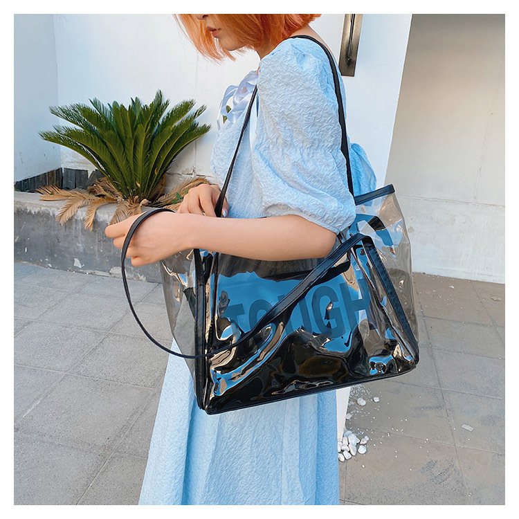 Custom Logo embossed holographic PVC tote bag for cosmetic packaging lifestyle shopping bag reusable waterproof shoulder bag