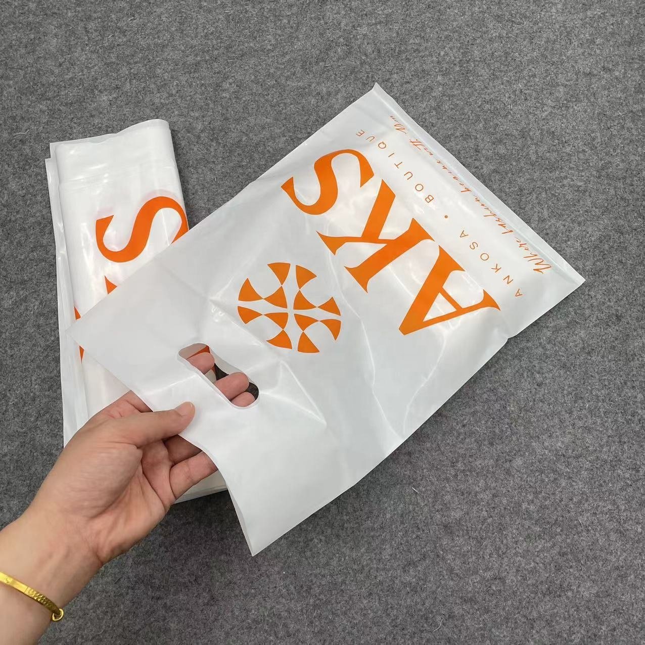 Wholesale Eco-friendly Recyclable Custom Logo Printed Die Cut Handle Plastic Packaging Shopping Bag For Clothing and Shoes
