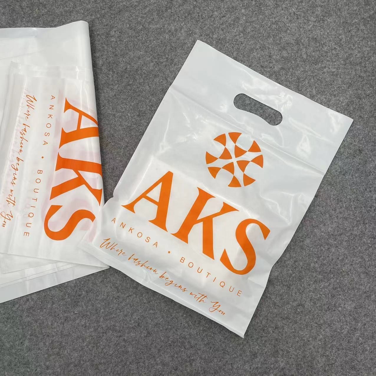 Wholesale Eco-friendly Recyclable Custom Logo Printed Die Cut Handle Plastic Packaging Shopping Bag For Clothing and Shoes