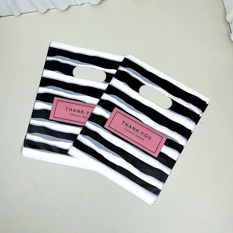Yiwu Oke Factory Wholesale Printed PE Plastic Gift Bag Fashion Portable Shopping and Clothing Packaging Bag