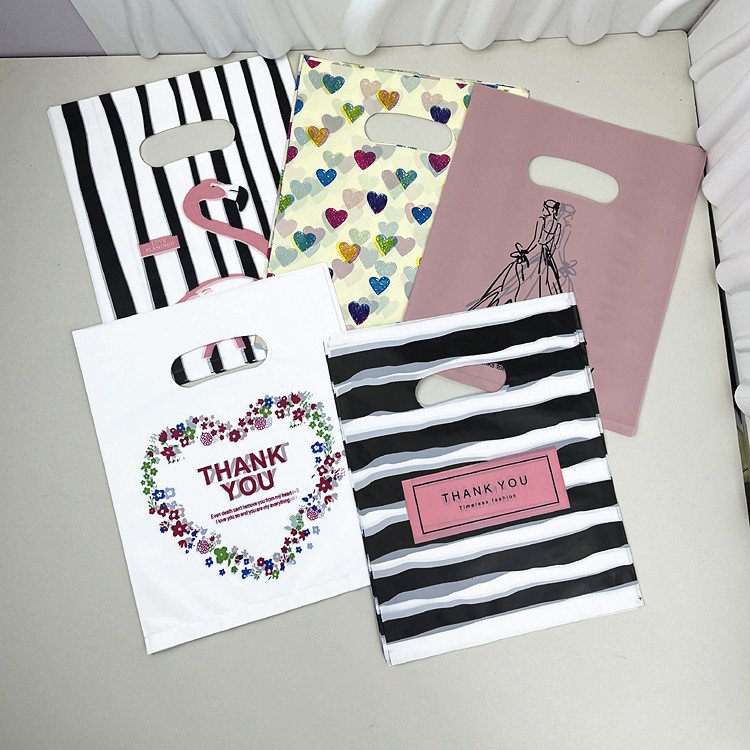 Yiwu Oke Factory Wholesale Printed PE Plastic Gift Bag Fashion Portable Shopping and Clothing Packaging Bag