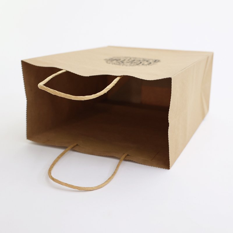 Custom Logo Printed brown Kraft Paper Bag Clothing Shoe Gift Packaging Wholesale Gift Paper Bag