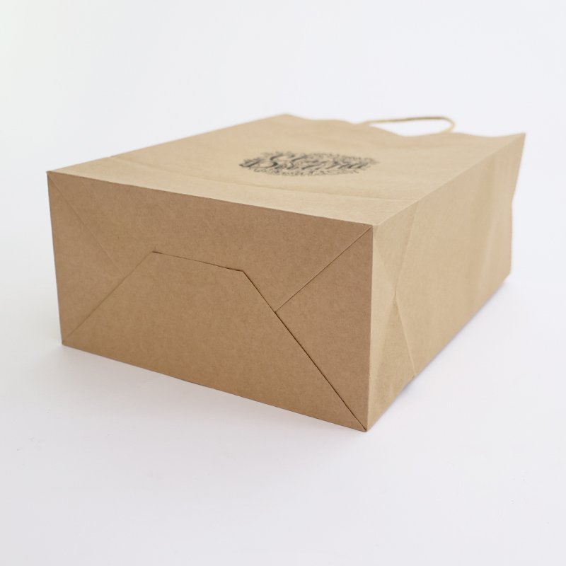 Custom Logo Printed brown Kraft Paper Bag Clothing Shoe Gift Packaging Wholesale Gift Paper Bag
