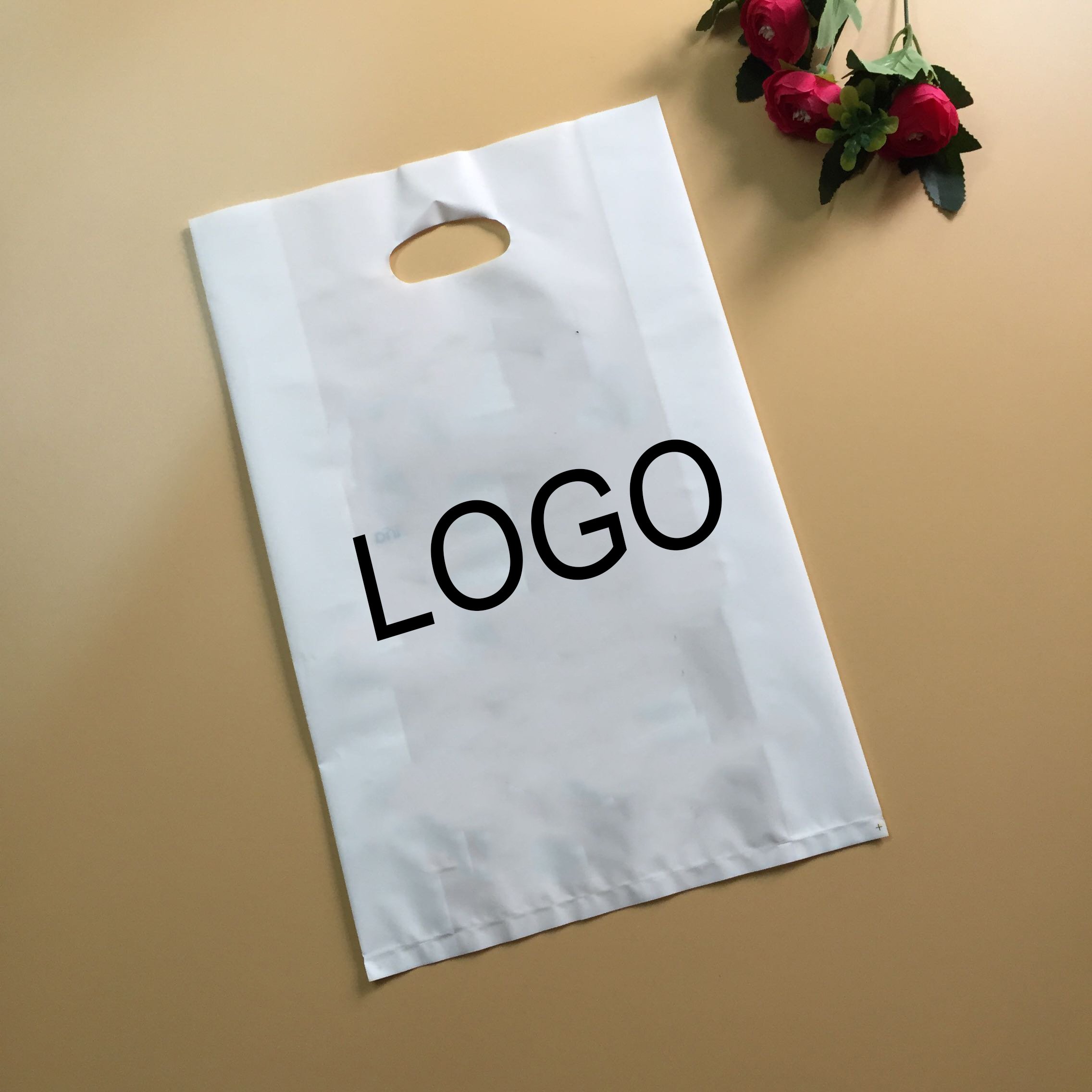 OEM custom logo patch handle plastic packaging bag shopping bag with logo plastic shopping bag