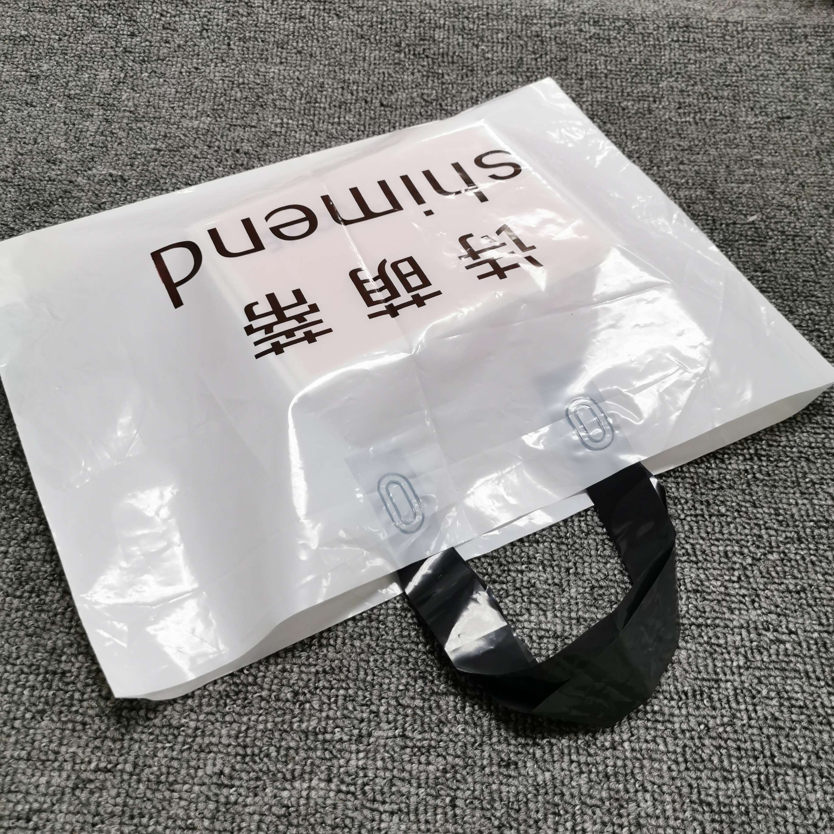 OEM custom logo patch handle plastic packaging bag shopping bag with logo plastic shopping bag