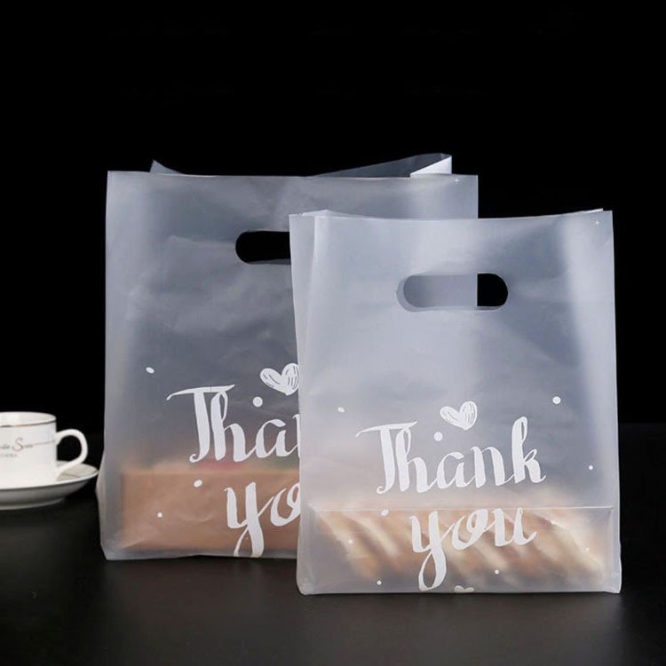 custom wholesale transparent Eco-Friendly Die Cut Handle Plastic Shopping Bags With Printing Logo