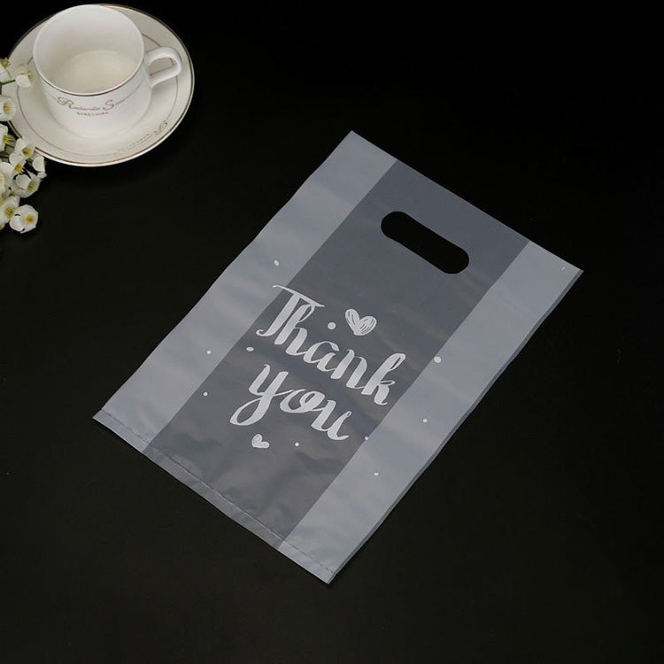 custom wholesale transparent Eco-Friendly Die Cut Handle Plastic Shopping Bags With Printing Logo