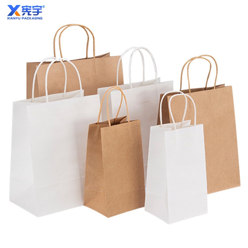 Custom logo 100pcs kraft paper shopping gift bag with handle party gift bag Clothing Packaging Shopping bag Gravure Printing