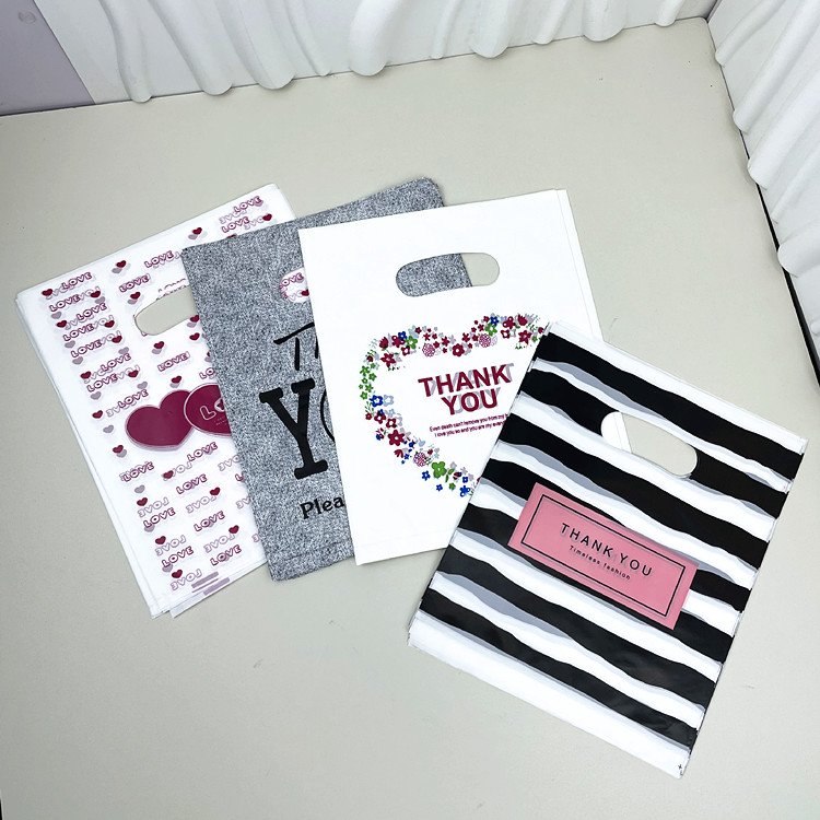 Yiwu Oke Factory Wholesale 30*40CM Shrink Fashion Print Clothing Shopping Bag Plastic Handbag Gift Packaging Bag