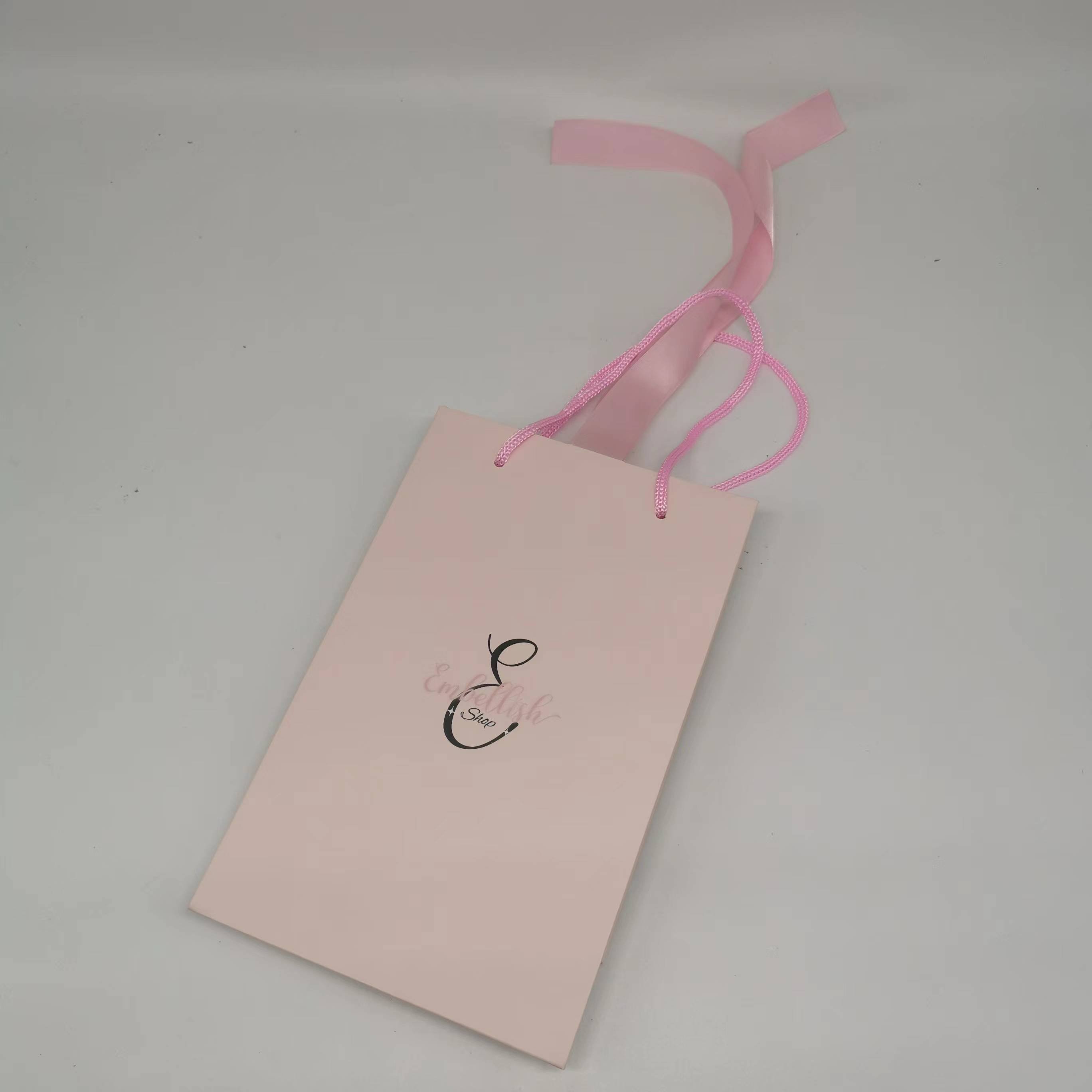Wholesale custom printed unique design paper shopping bag with handles and ribbon