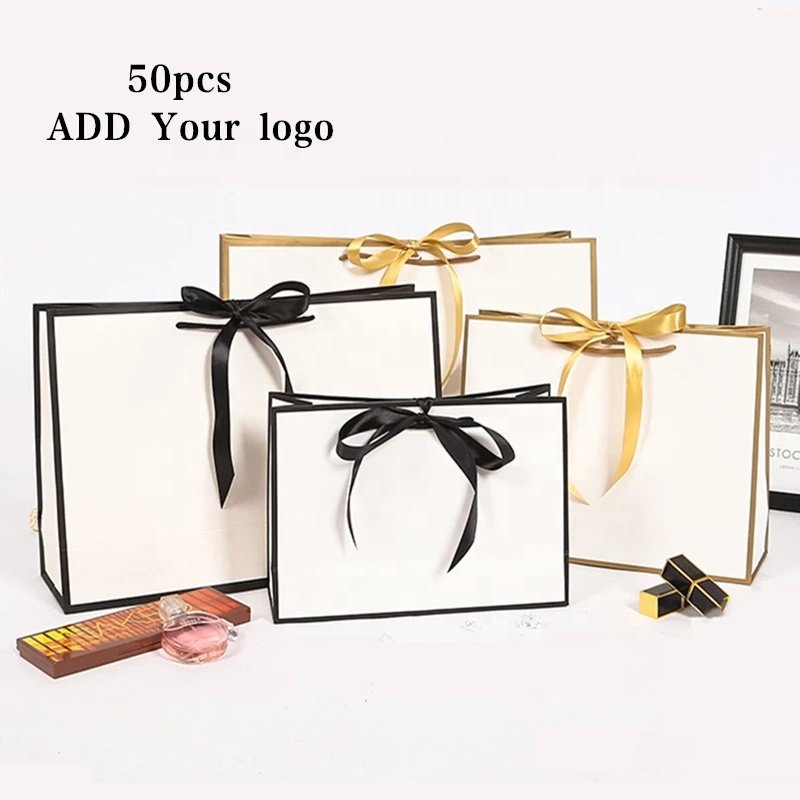 Custom logo printing luxury hot pink fashion shopping paper bag with ribbon handle