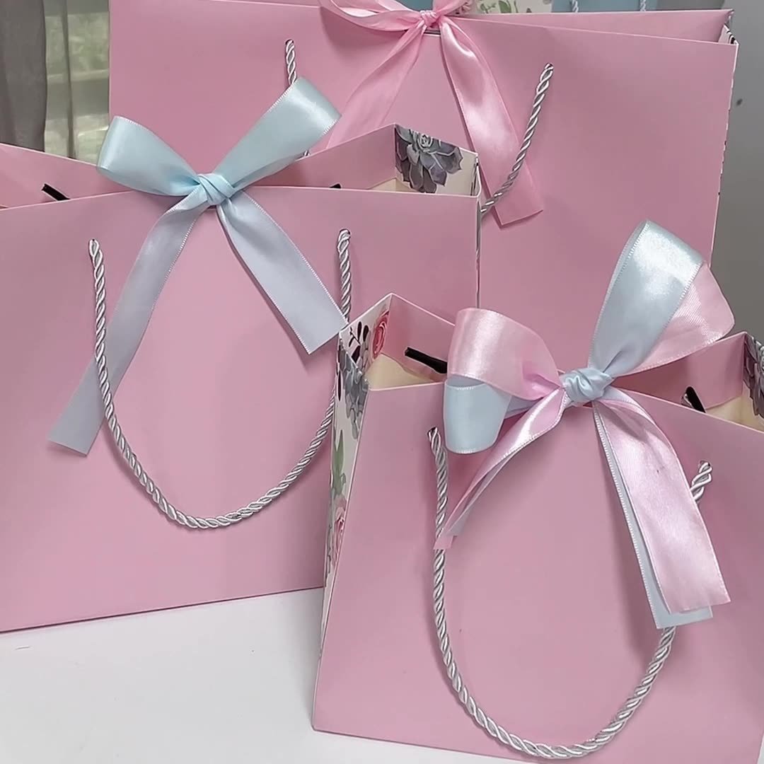 Customized pink sac en carton avec logo luxury jewelry clothing gift shopping packaging bags for small businesses with bow
