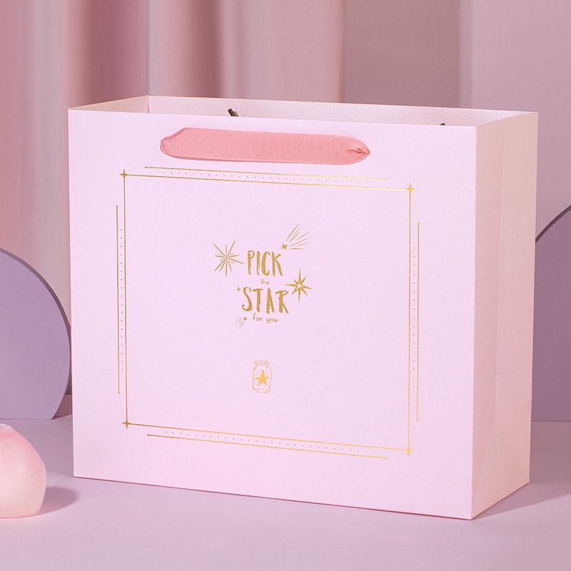 Factory direct supply gift bags customized Free design clothing cosmetics shopping bags Premium feeling handbag paper bags