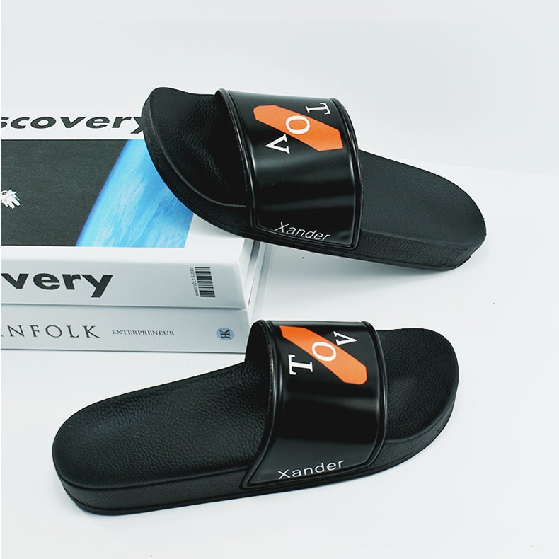 The factory wholesale custom black PVC women slides slippers men custom logo slippers
