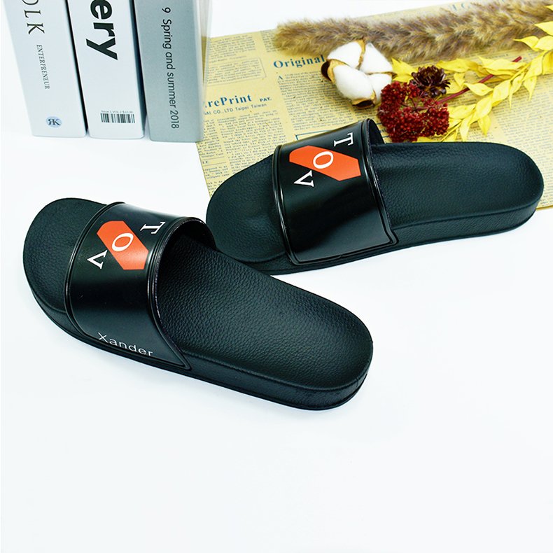 The factory wholesale custom black PVC women slides slippers men custom logo slippers