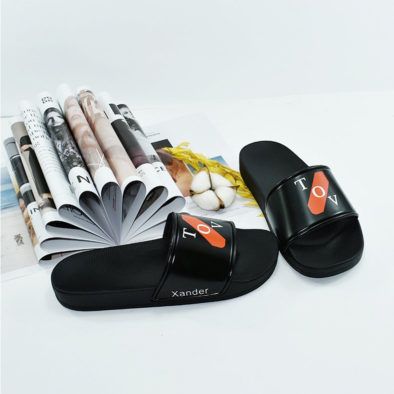 The factory wholesale custom black PVC women slides slippers men custom logo slippers