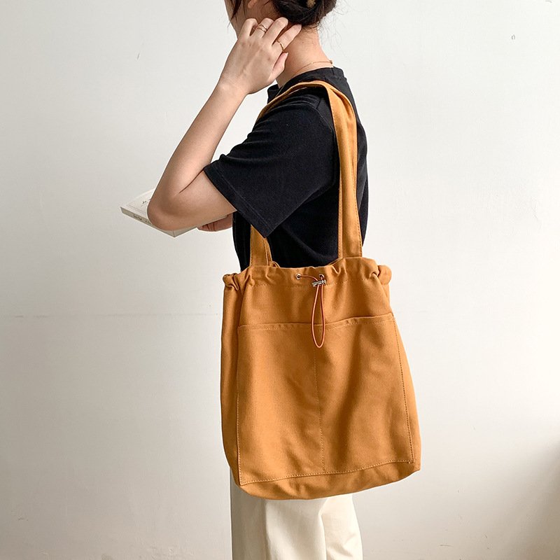 Korean version of the trend ins shoulder bag female casual canvas bag wholesale large capacity fold design Tote bag