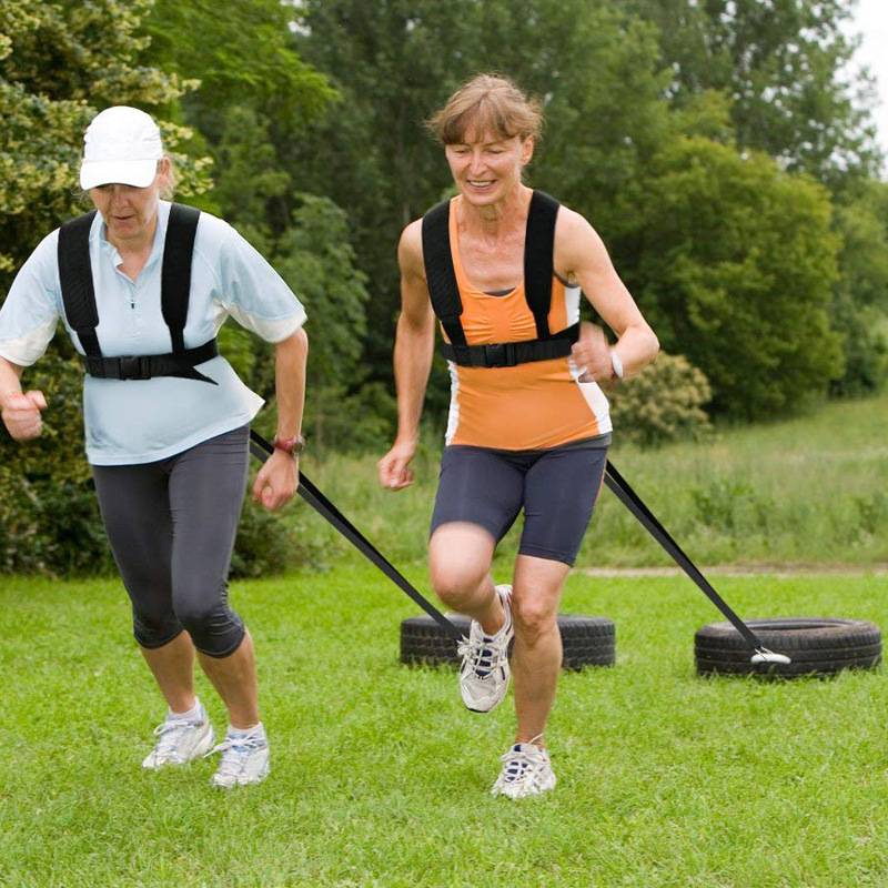 The heavy weight drag with the tire sled iron block dragging the load with track and field resistance waist explosion training belt
