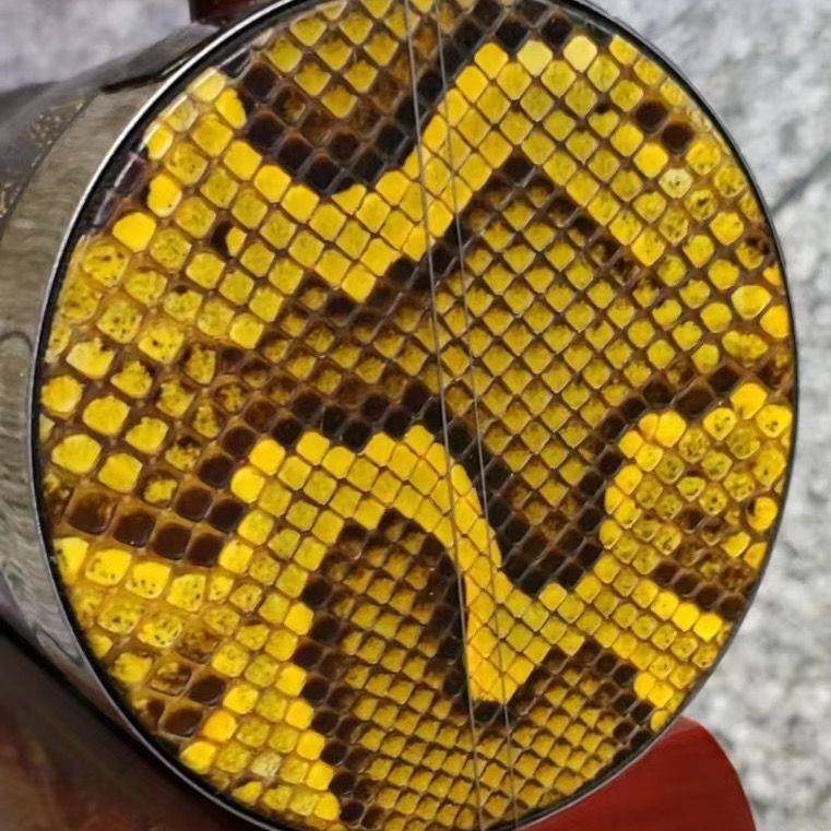 Open a round hole on the top of the python leather drum baked baked tube