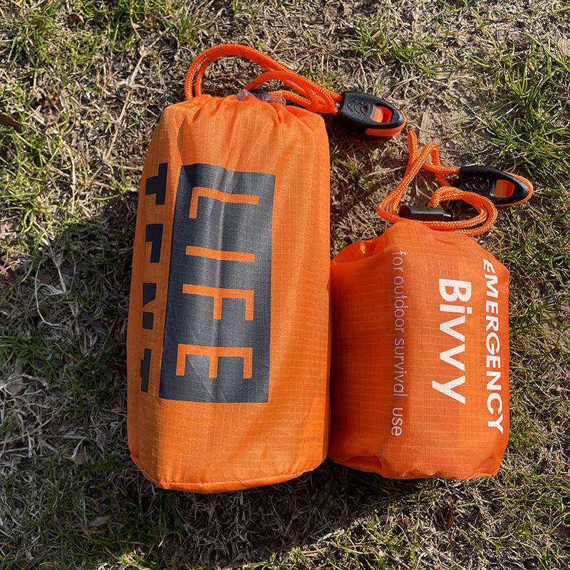 Together with 1 orange silver sleeping bag tent 1 each